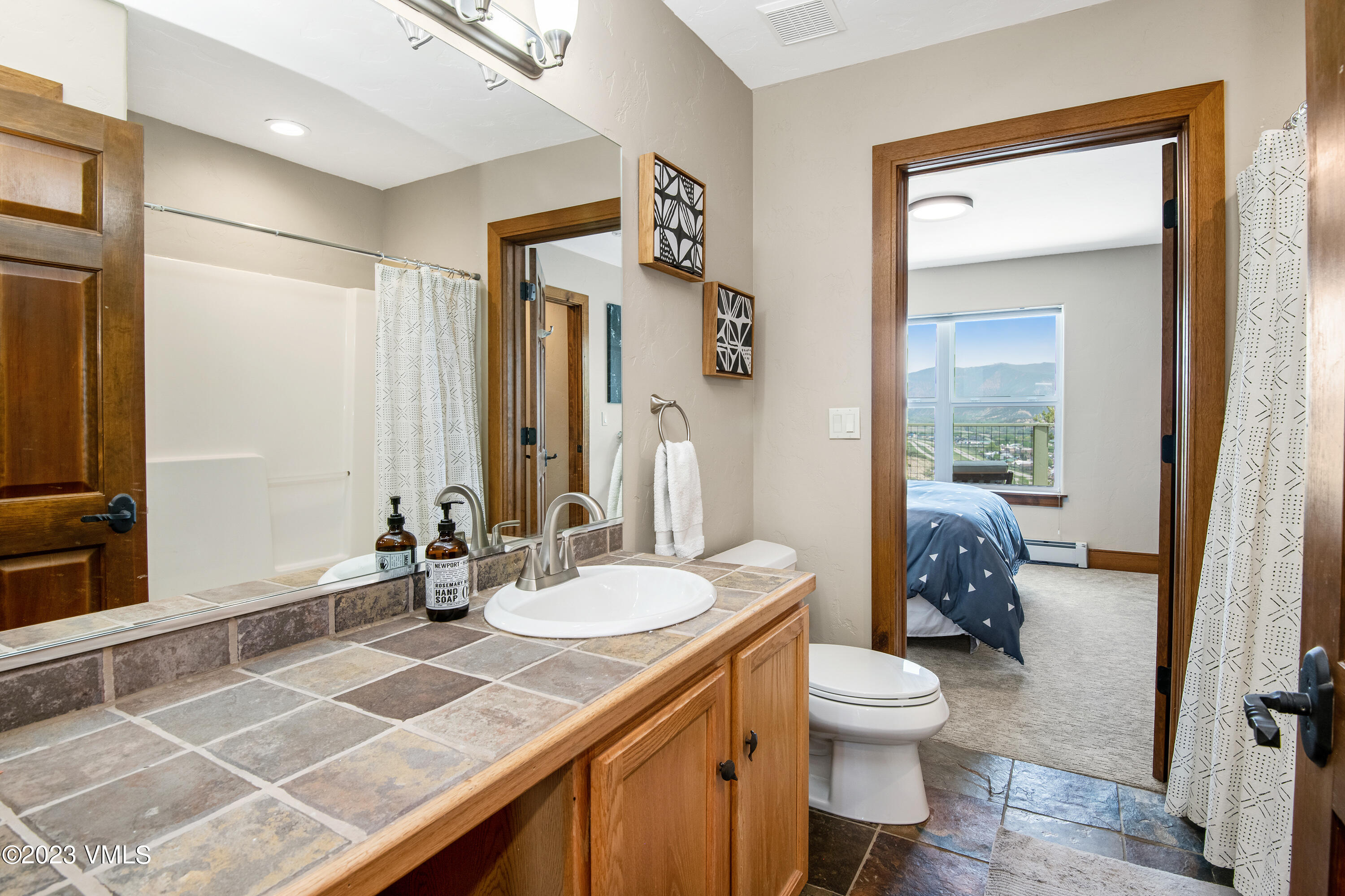 686 Mesa Drive Eagle, CO 81631 - Photo 33 of 73 a bathroom with a sink a toilet and shower