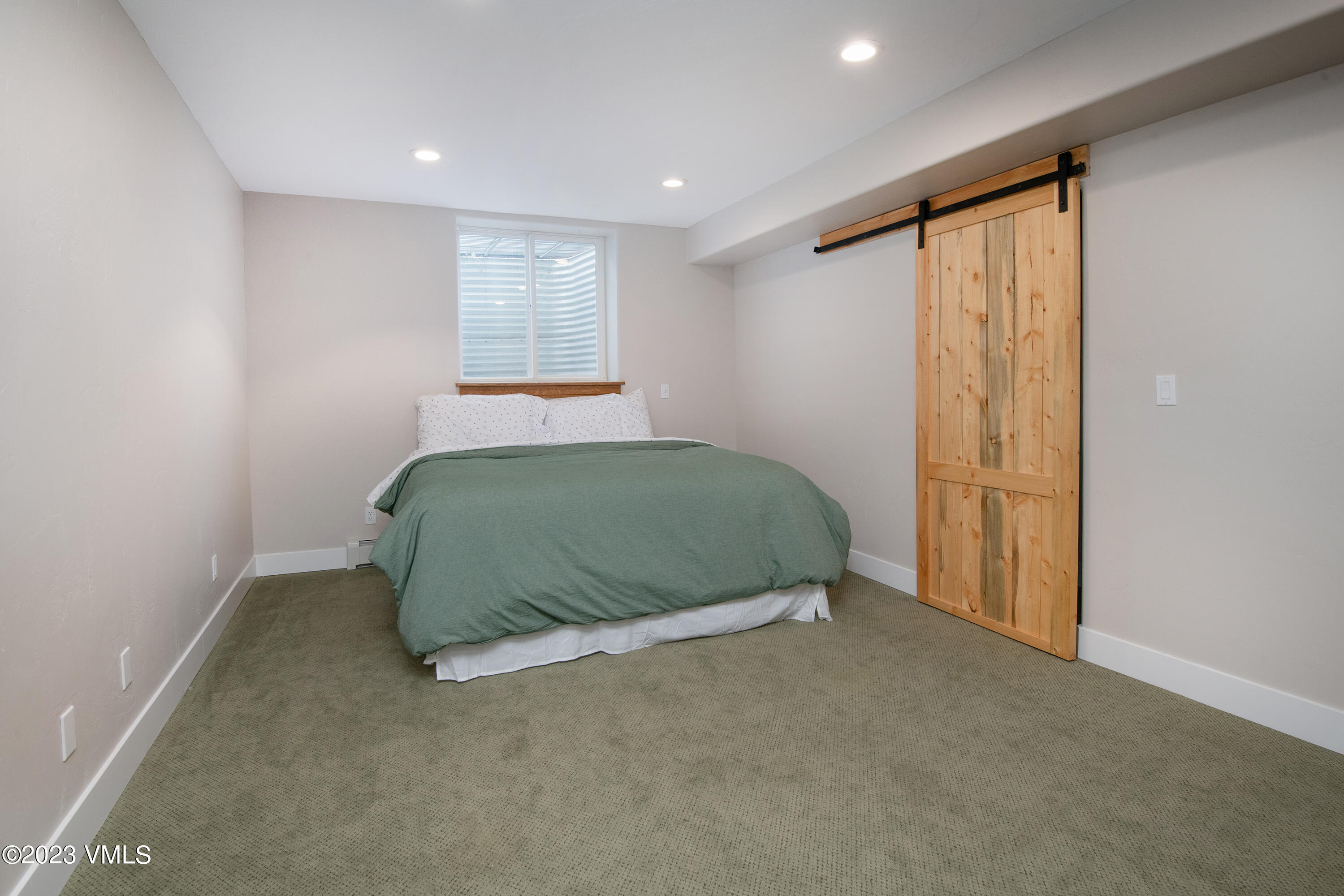 686 Mesa Drive Eagle, CO 81631 - Photo 43 of 73 a room with a bed and a window