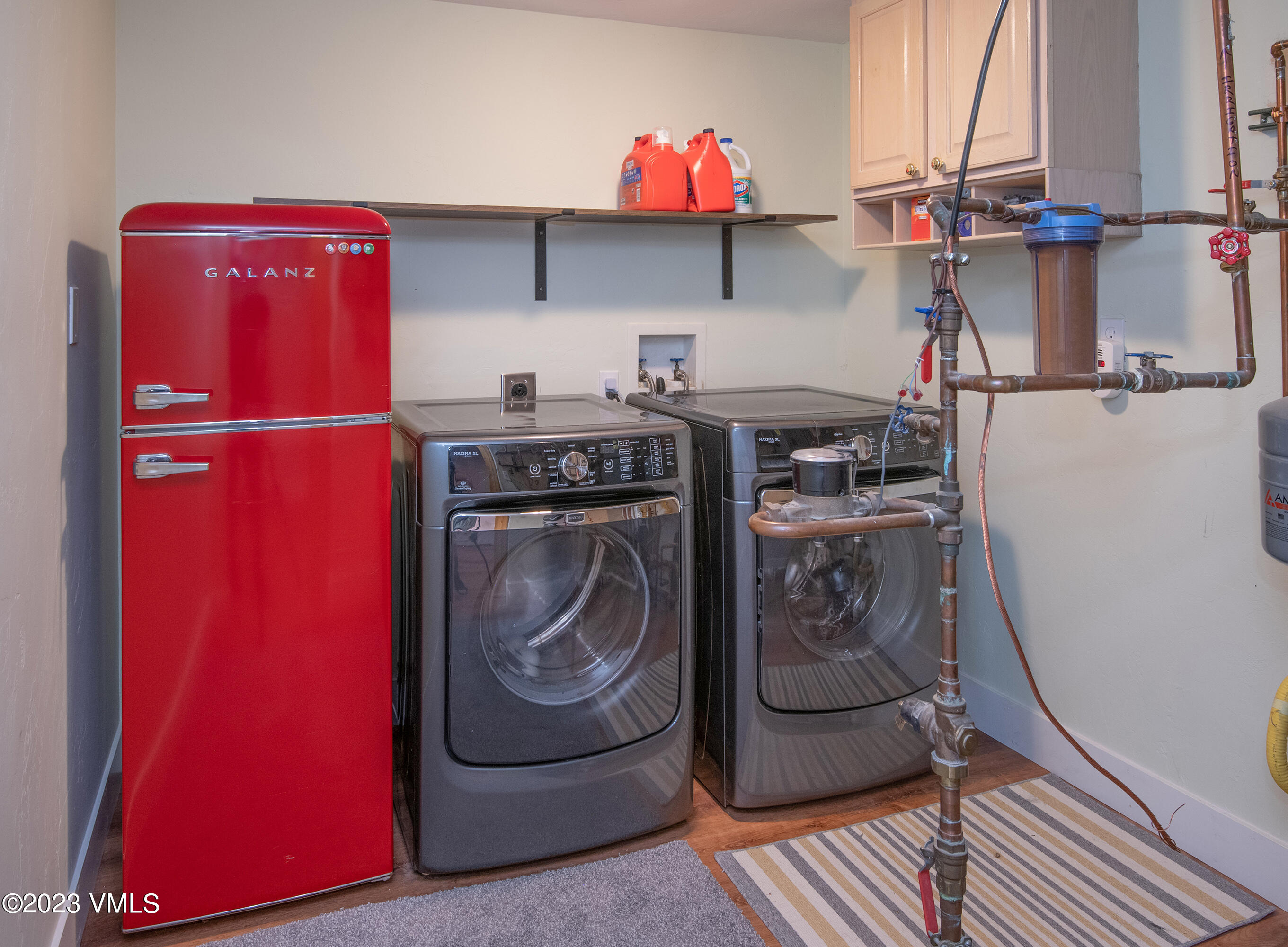 686 Mesa Drive Eagle, CO 81631 - Photo 47 of 73 a utility room with dryer washer and stair