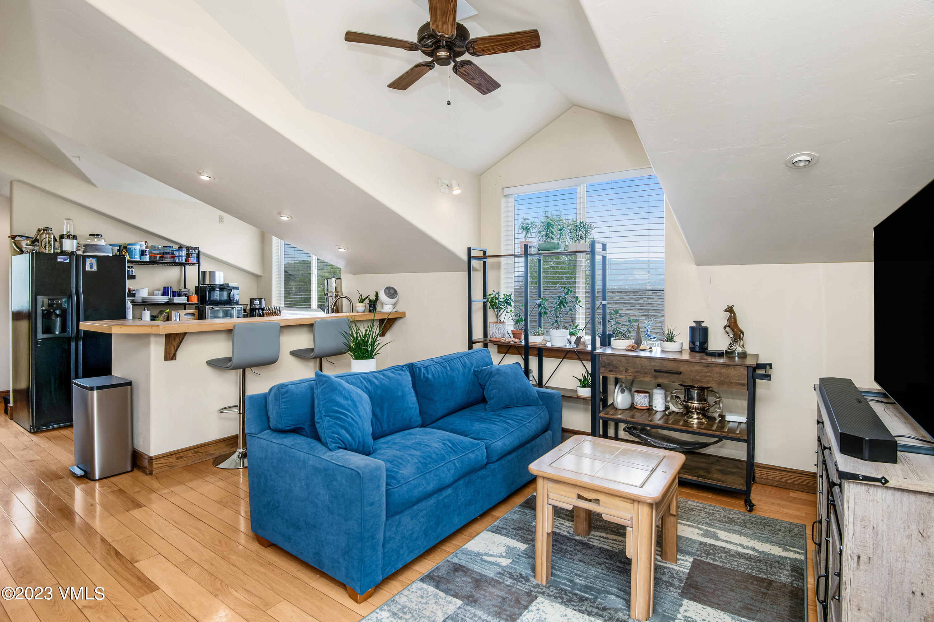 686 Mesa Drive Eagle, CO 81631 - Photo 61 of 73 a living room with furniture kitchen view and a large window