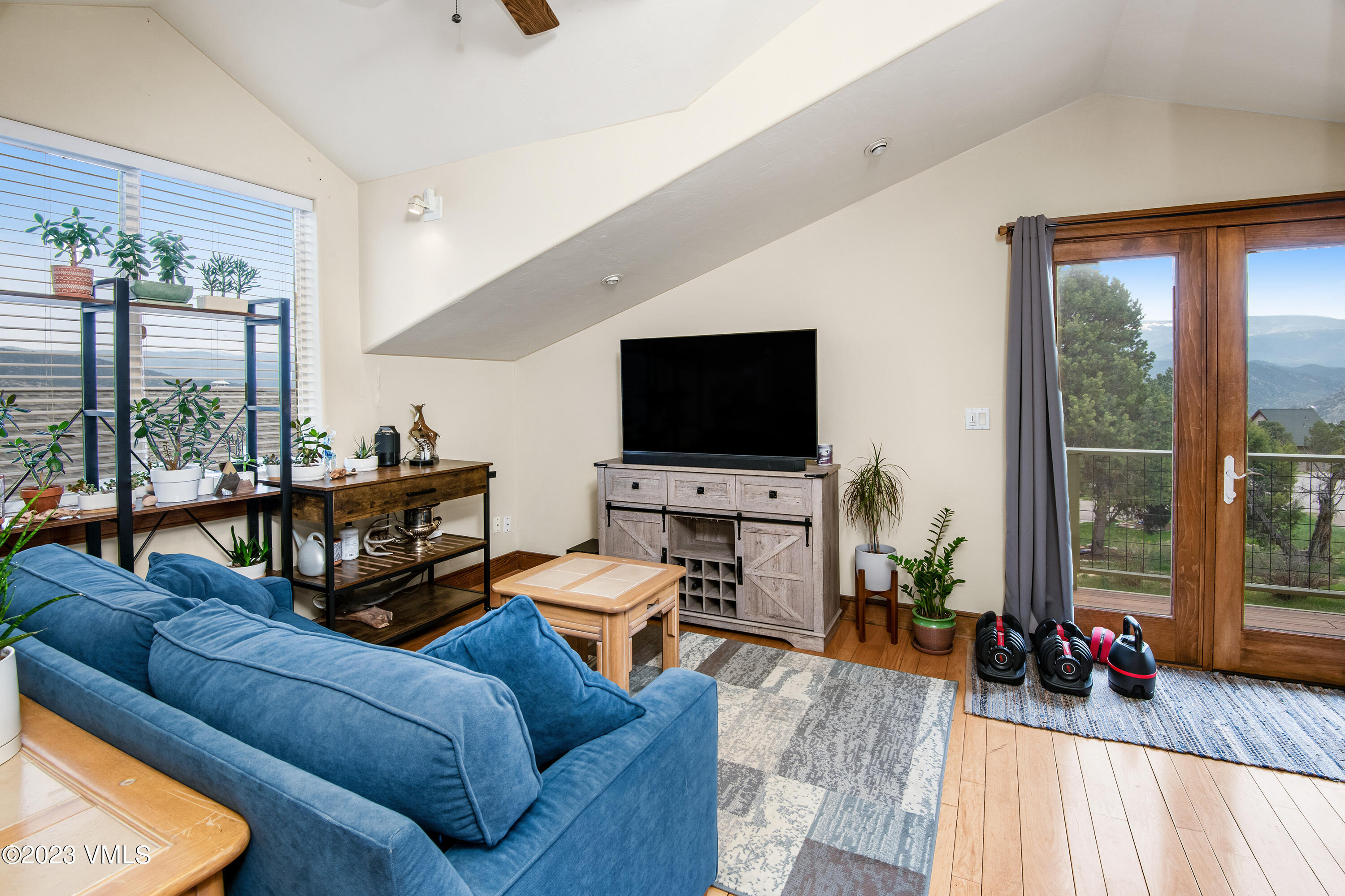 686 Mesa Drive Eagle, CO 81631 - Photo 62 of 73 a living room with furniture and a flat screen tv