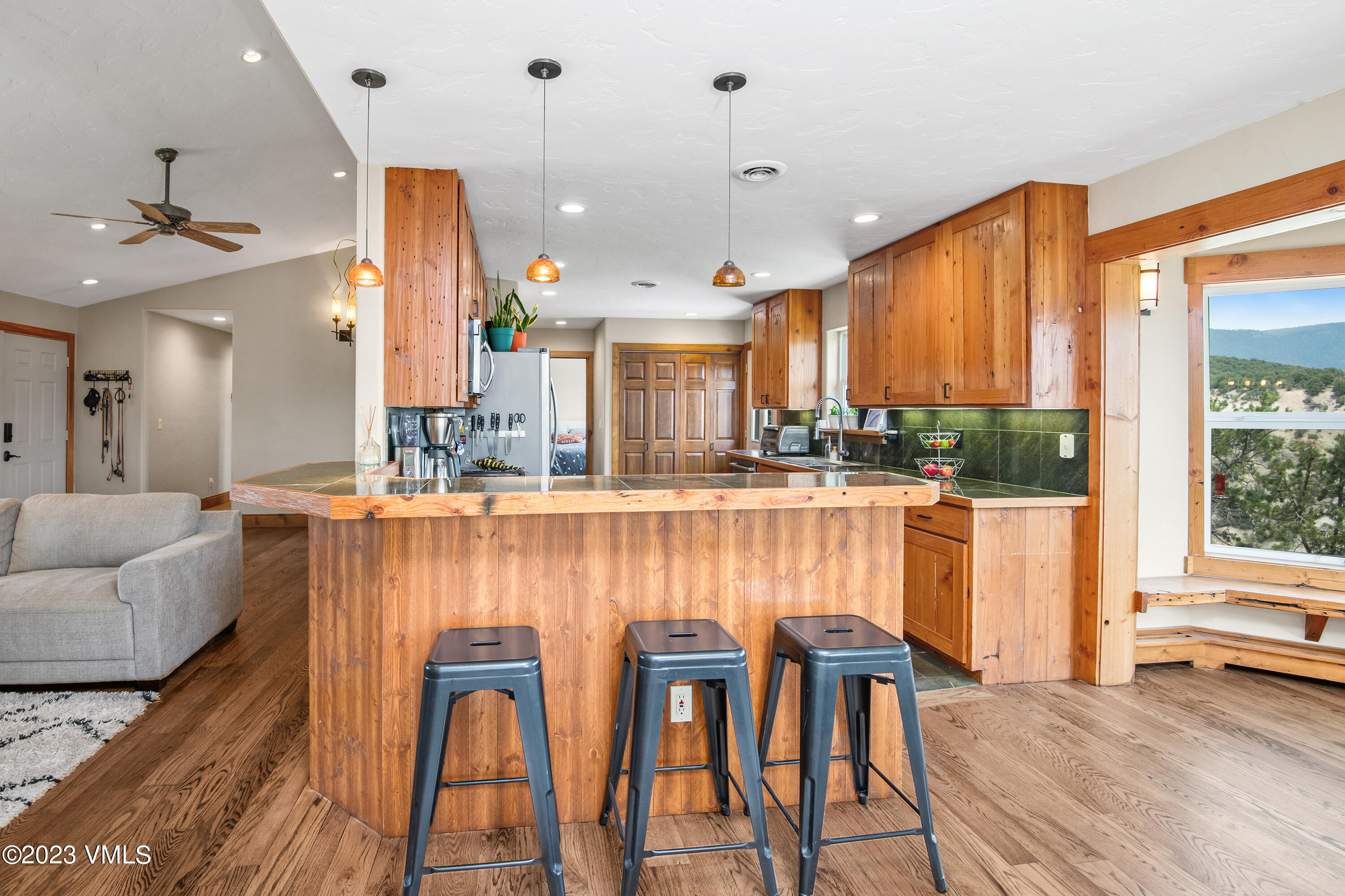 686 Mesa Drive Eagle, CO 81631 - Photo 9 of 73 a large kitchen with a table and chairs