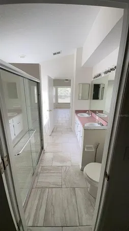 a bathroom with a sink and mirror