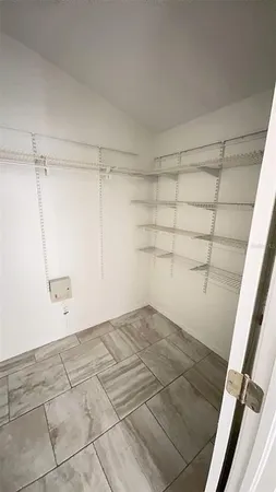 a view of a room with racks on the wall