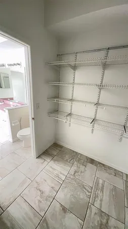 a view of a room with racks on the wall