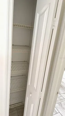 a bathroom with a granite countertop sink a toilet a mirror and shower