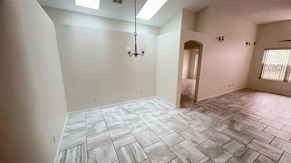 a view of empty room with windows