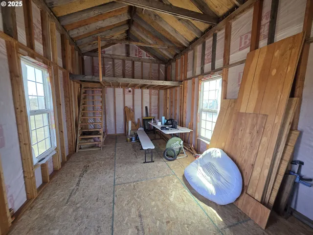a view of a room with furniture and a window