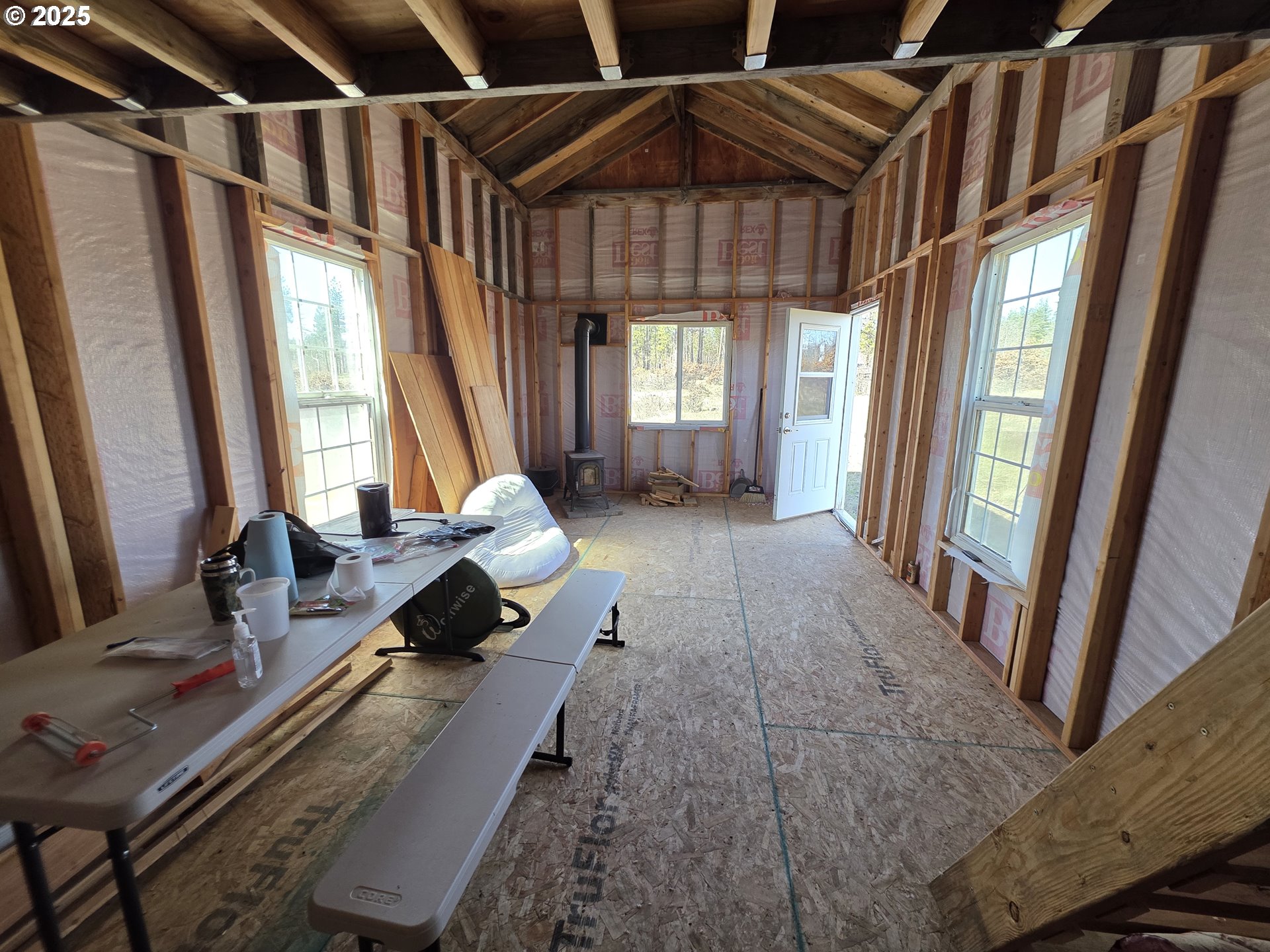 15 Sutherland Trail Goldendale, WA 98620 - Photo 9 of 12 a living room with furniture and a floor to ceiling window