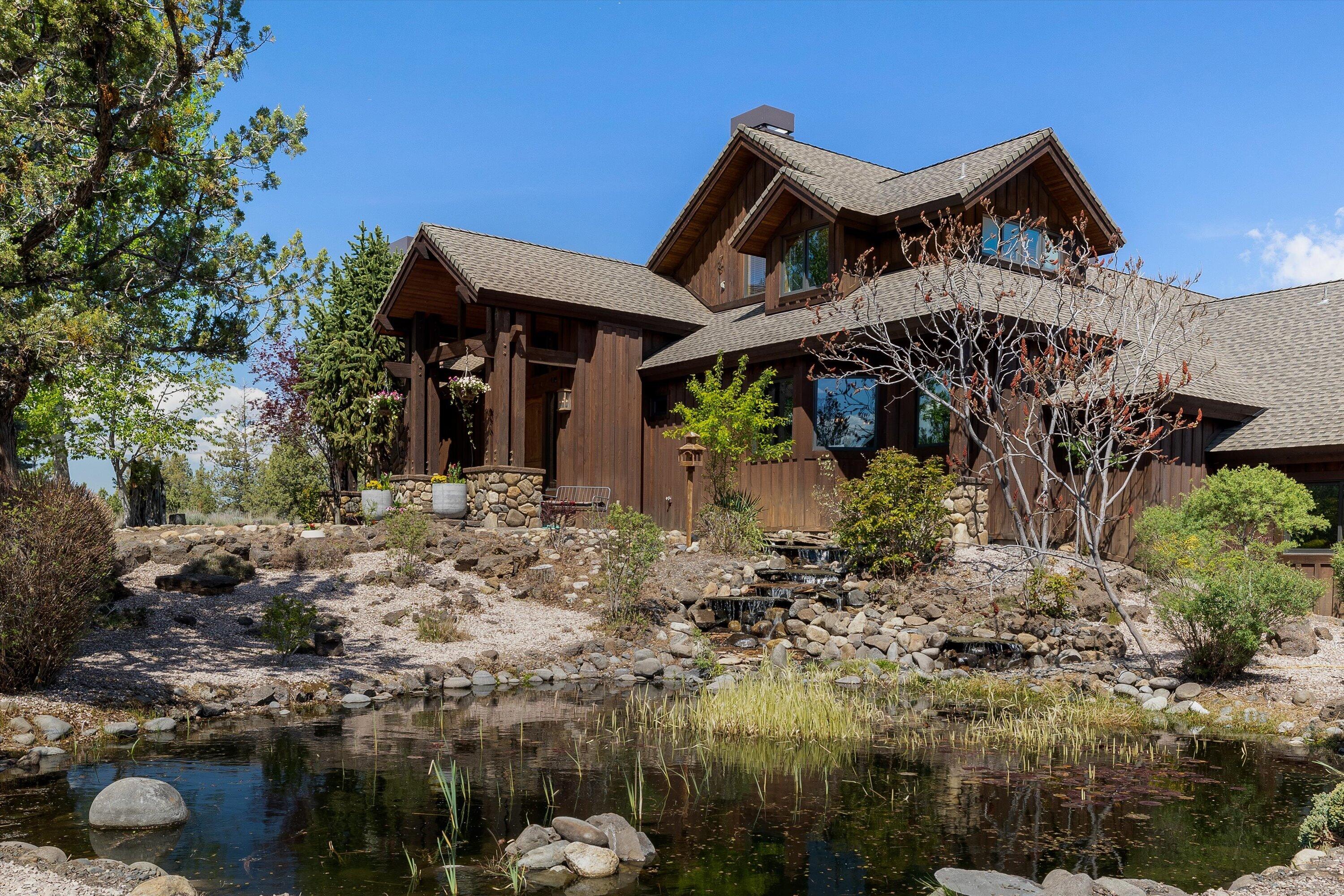 64155 Hunnell Road Bend, OR 97703 - Photo 3 of 96 Stunning entry with gorgeous pond and waterfall.
