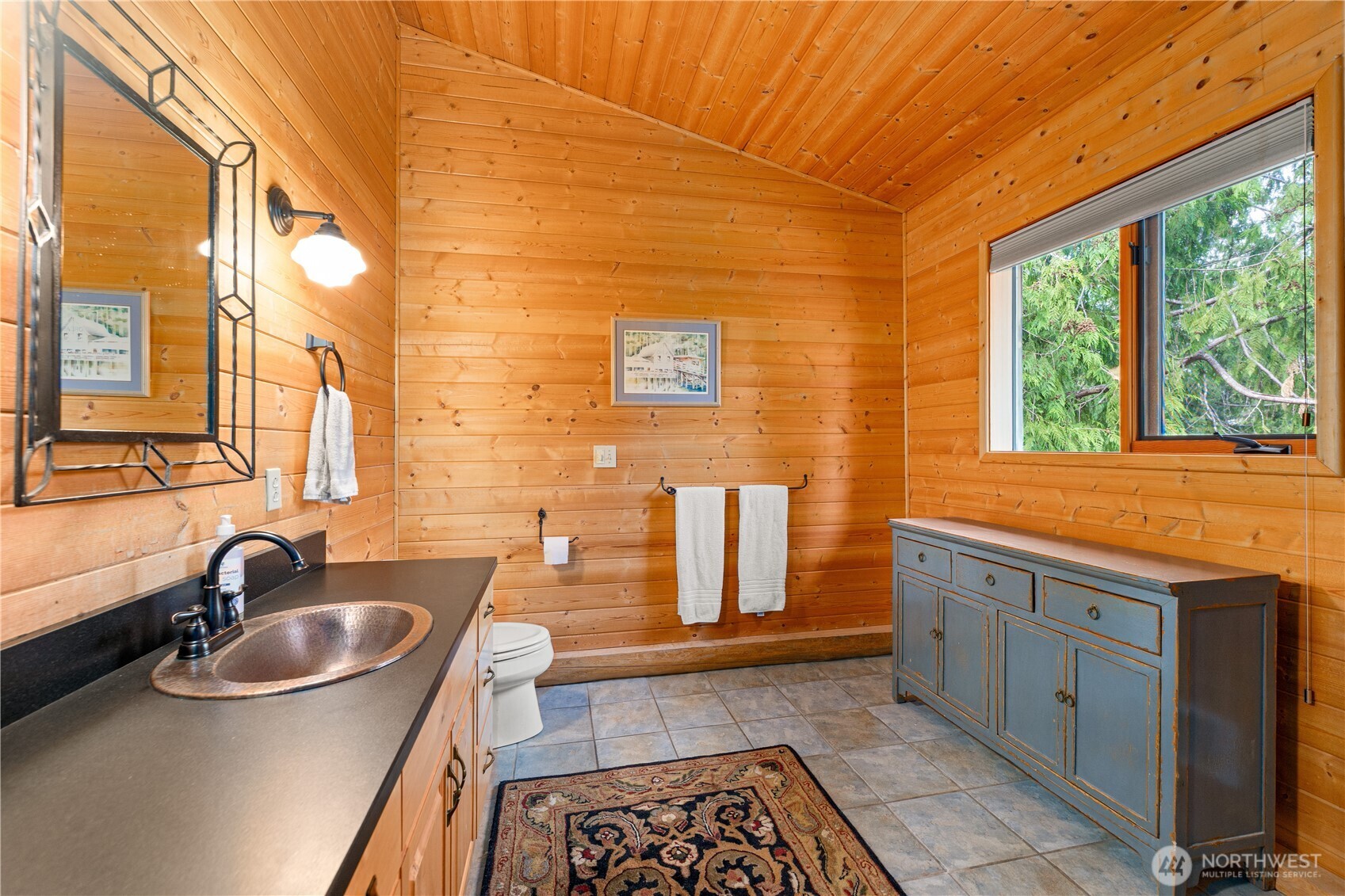 134 Sacred Moon Way Friday Harbor, WA 98250 - Photo 19 of 35 a kitchen with stainless steel appliances granite countertop a sink a stove and wooden cabinets