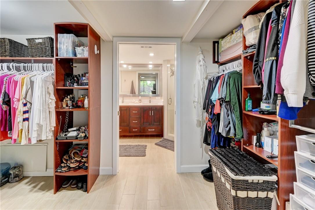 8129 Boca Rio Drive Boca Raton, FL 33433 - Photo 18 of 39 a view of walk in closet with clothes and shoes