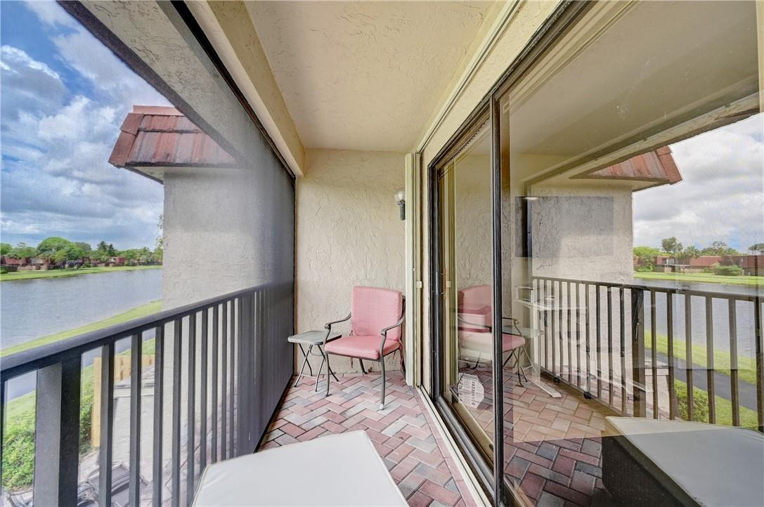 8129 Boca Rio Drive Boca Raton, FL 33433 - Photo 21 of 39 a view of a balcony with a potted plant