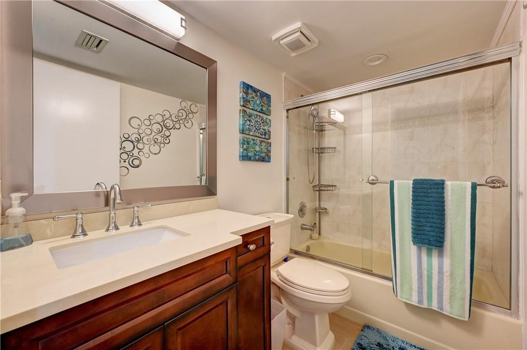 8129 Boca Rio Drive Boca Raton, FL 33433 - Photo 26 of 39 a bathroom with a sink a toilet and shower