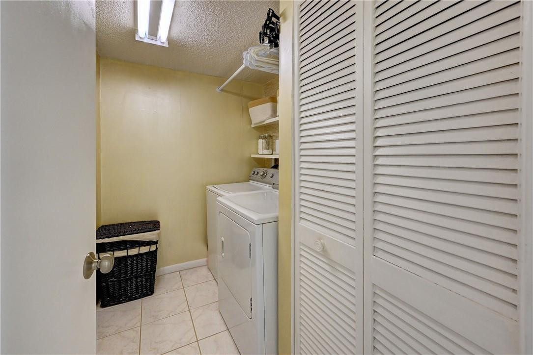 8129 Boca Rio Drive Boca Raton, FL 33433 - Photo 30 of 39 a utility room with dryer and washer