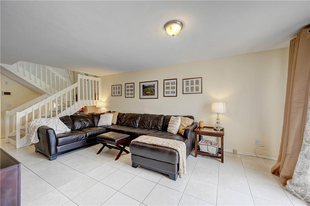 8129 Boca Rio Drive Boca Raton, FL 33433 - Photo 5 of 39 a living room with furniture and a wooden floor