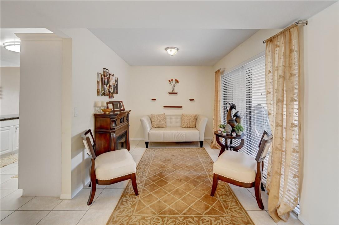 8129 Boca Rio Drive Boca Raton, FL 33433 - Photo 7 of 39 a living room with furniture and a window
