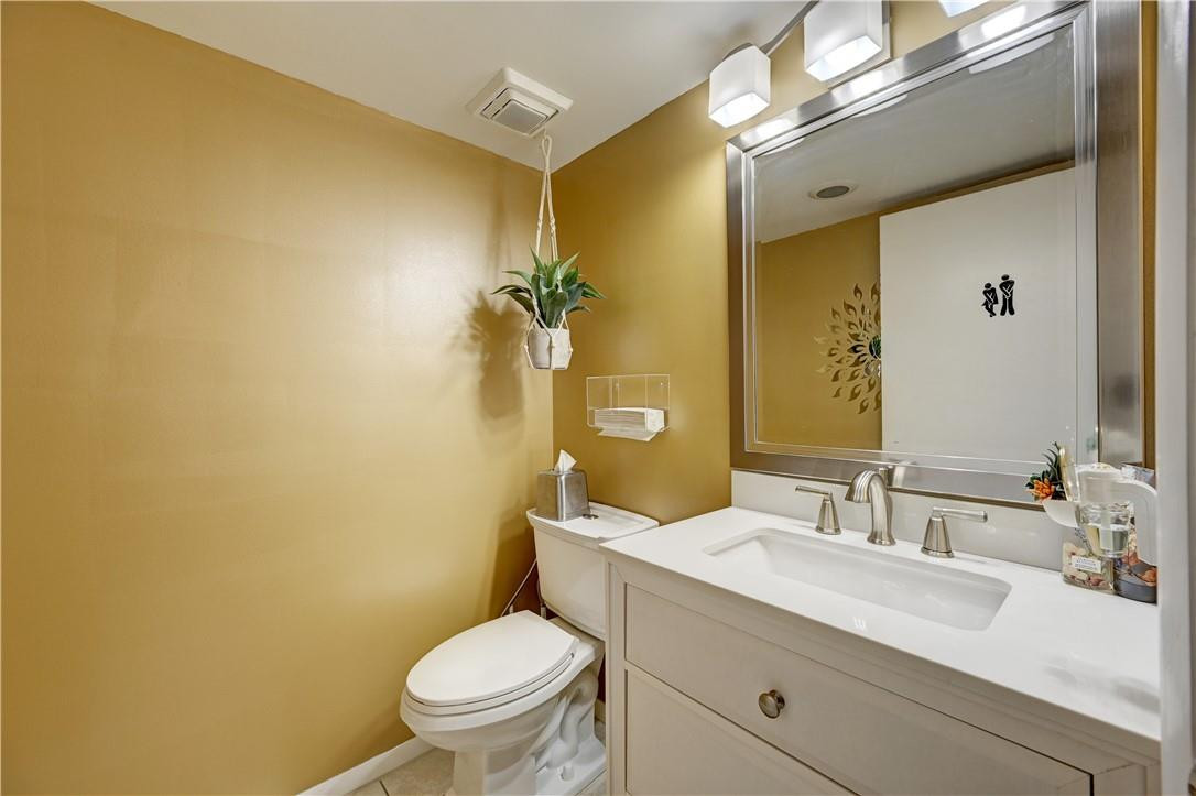 8129 Boca Rio Drive Boca Raton, FL 33433 - Photo 8 of 39 a bathroom with a granite countertop sink toilet and a mirror