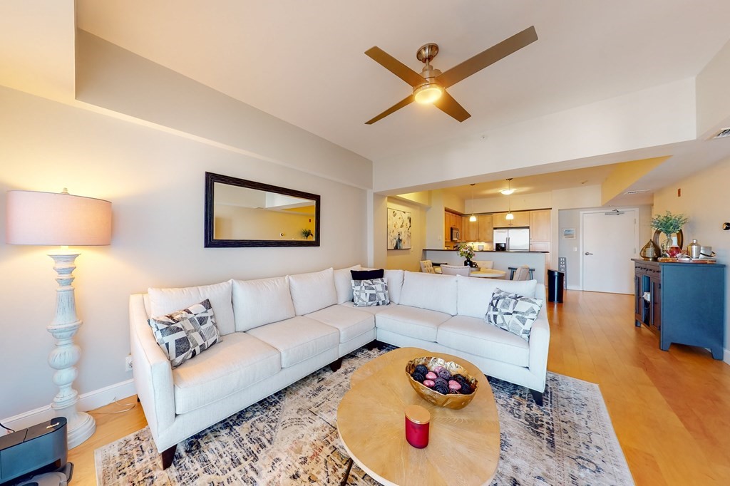 550 Pleasant Street, Unit 208 Winthrop, MA 02152 - Photo 5 of 32 a living room with furniture and a rug