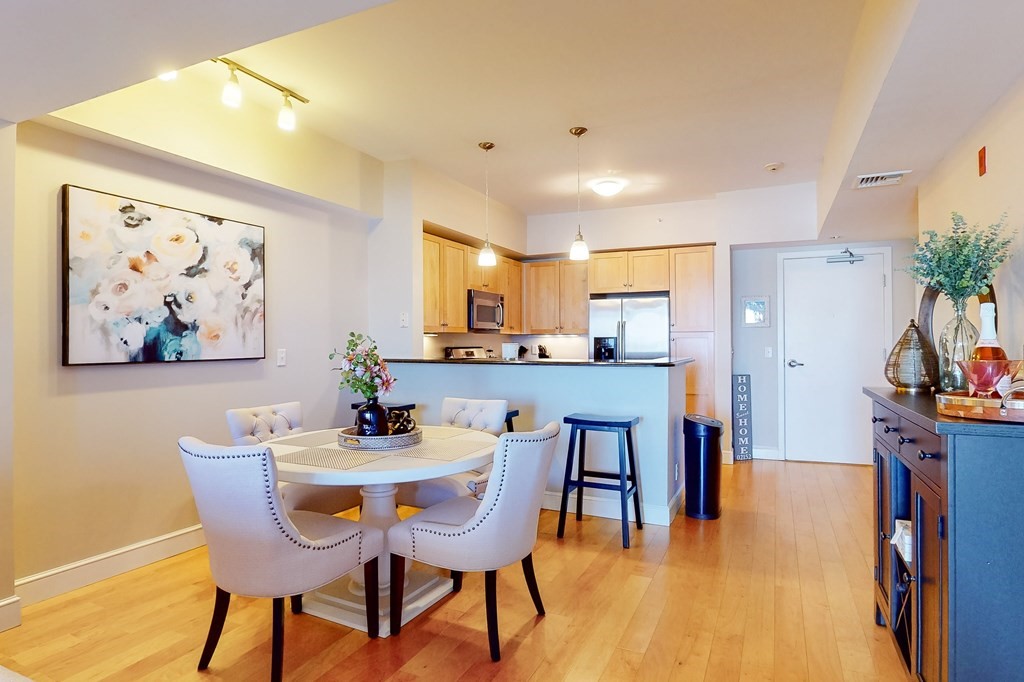 550 Pleasant Street, Unit 208 Winthrop, MA 02152 - Photo 9 of 32 a dining room with furniture and window