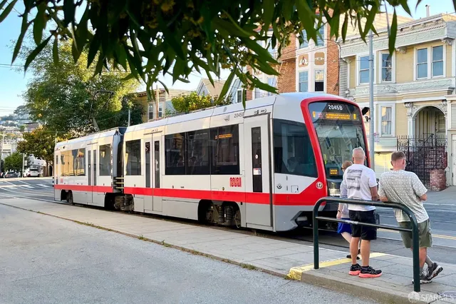 a group of people sitting in front of cafe