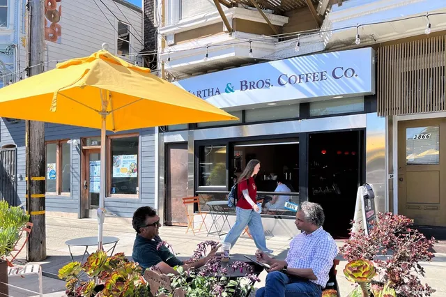 a view of store with outdoor seating