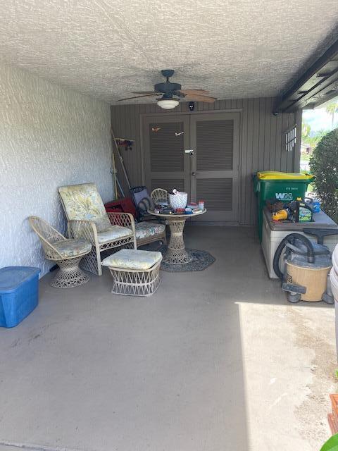 7848 Beechfern Circle, Unit 39 Tamarac, FL 33321 - Photo 16 of 19 a living room with furniture a window and a table