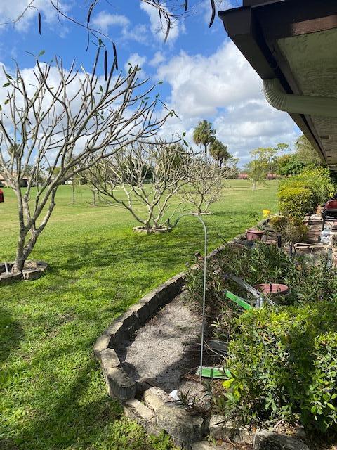 7848 Beechfern Circle, Unit 39 Tamarac, FL 33321 - Photo 18 of 19 a view of a garden with an outdoor space