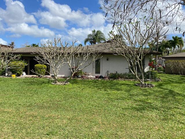 7848 Beechfern Circle, Unit 39 Tamarac, FL 33321 - Photo 19 of 19 a view of a house with a yard