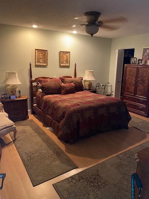 7848 Beechfern Circle, Unit 39 Tamarac, FL 33321 - Photo 4 of 19 a bedroom with double bed and a couch