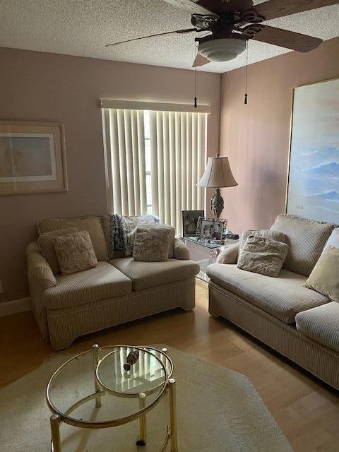 7848 Beechfern Circle, Unit 39 Tamarac, FL 33321 - Photo 9 of 19 a living room with furniture and a large window