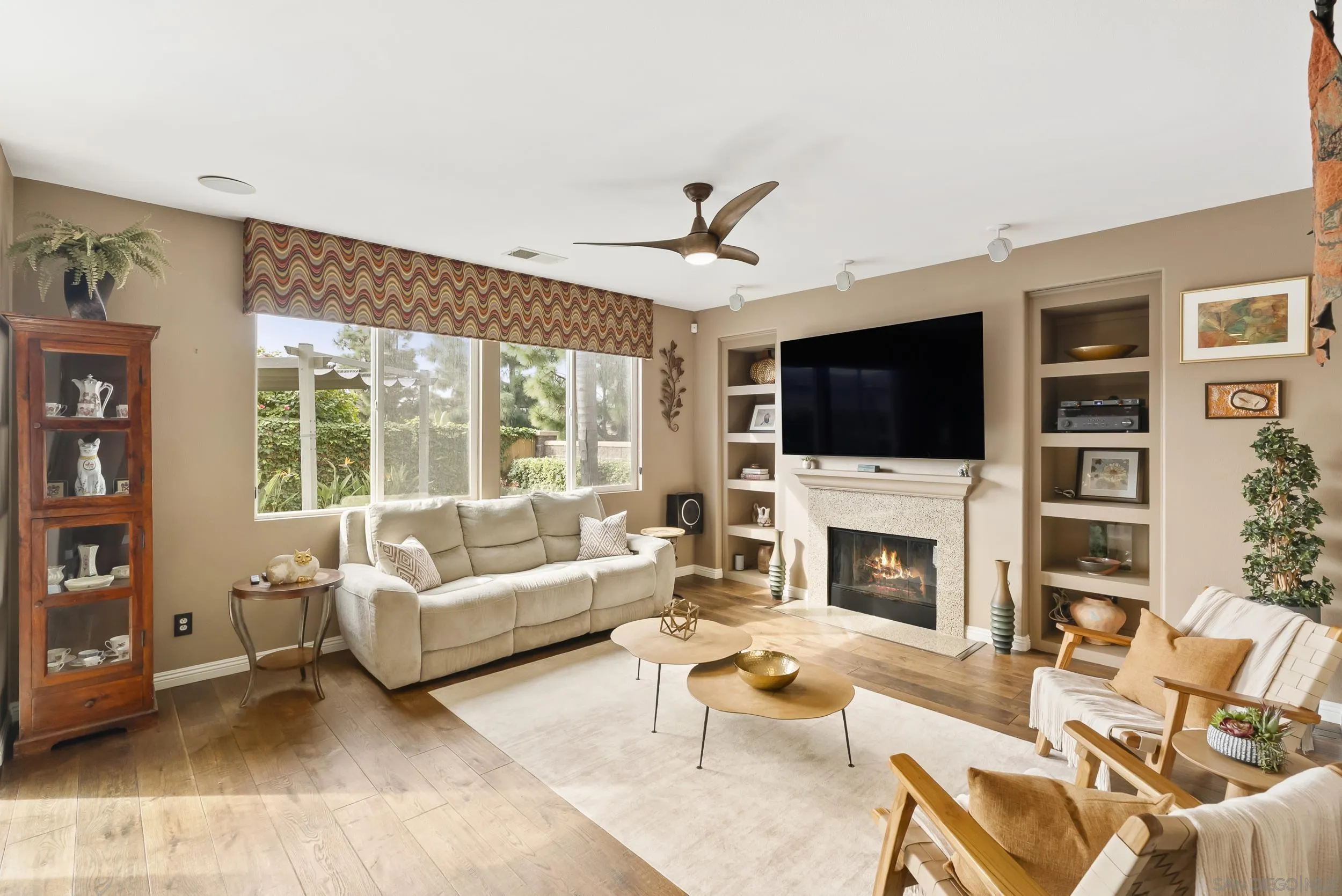 1802 Webber Way Chula Vista, CA 91913 - Photo 11 of 52 a living room with furniture a fireplace and a flat screen tv