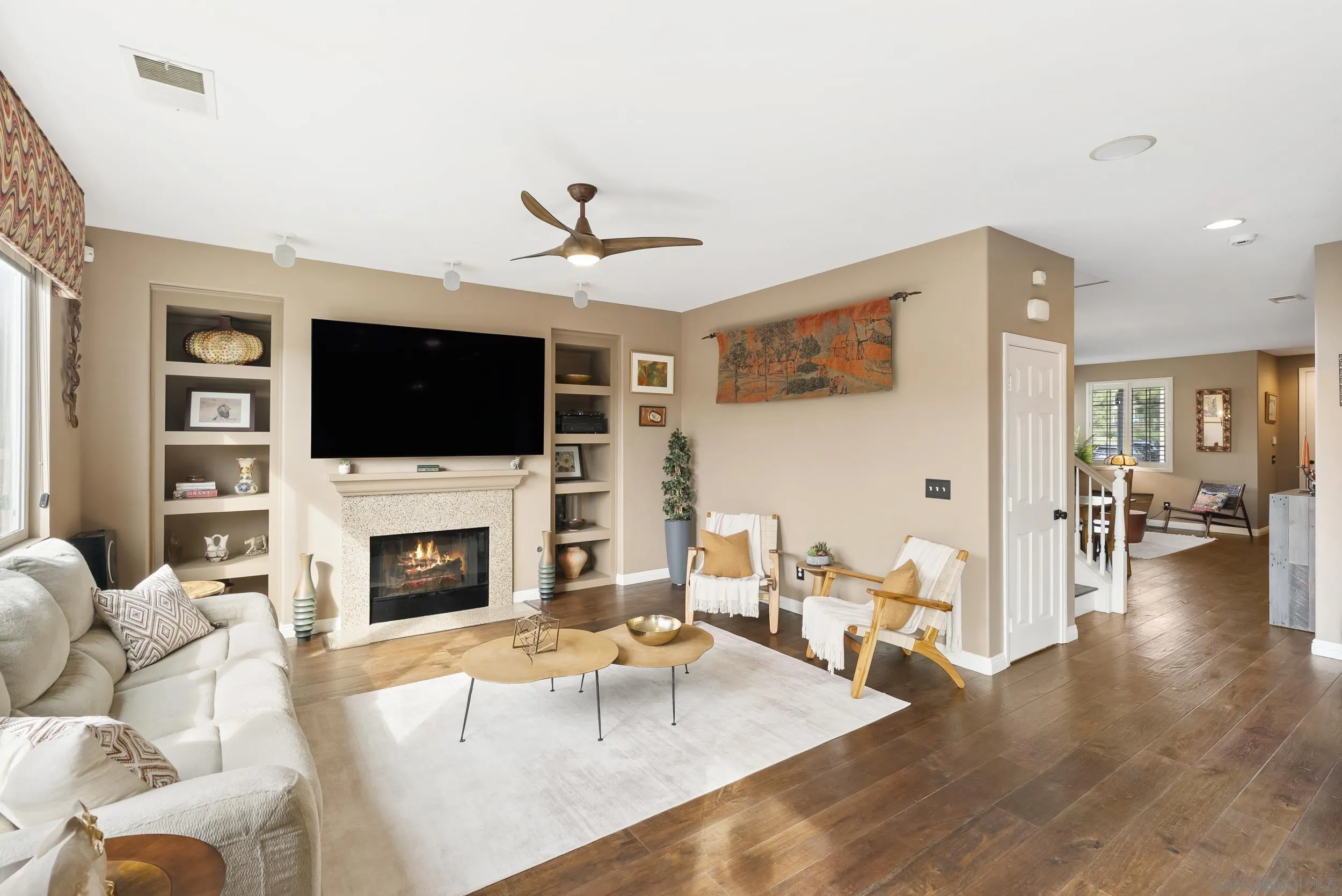 1802 Webber Way Chula Vista, CA 91913 - Photo 13 of 52 a living room with furniture a flat screen tv and a fireplace