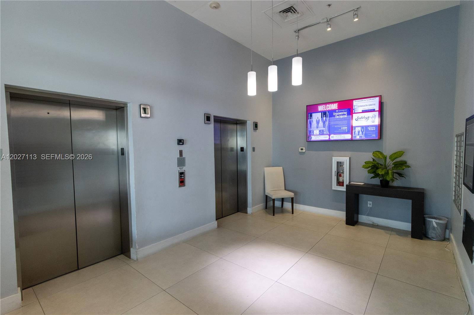 7275 Southwest 90th Way, Unit 213 Miami, FL 33156 - Photo 2 of 31 a lobby with furniture and a potted plant