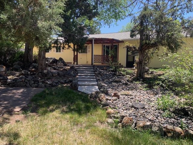 570 Southwest 2nd Court Cedaredge, CO 81413 - Photo 21 of 32 a view of a house with a yard