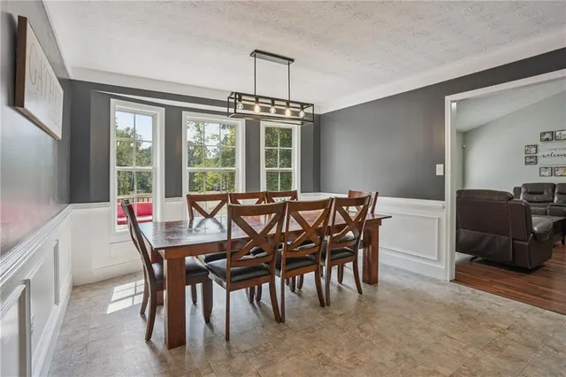 a view of a dining room with furniture window and outside view