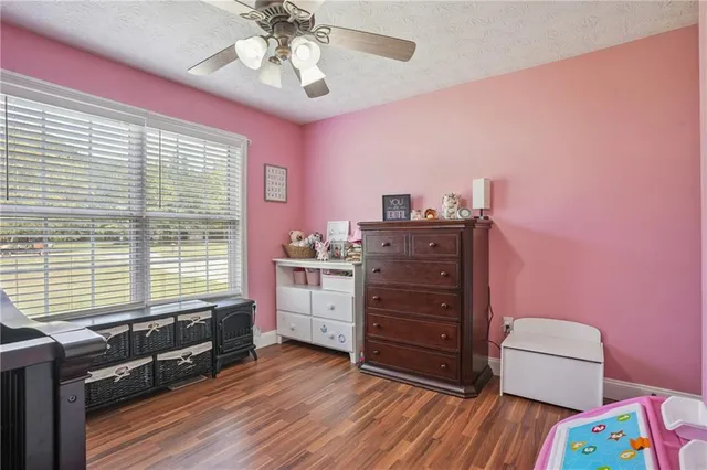 a room with furniture and a dresser