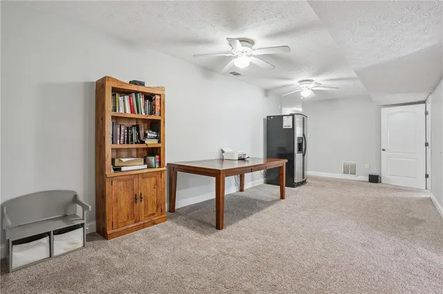 a view of a workspace with furniture