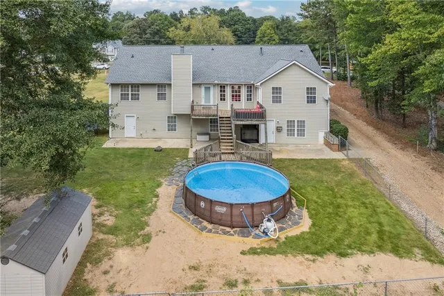 a view of a house with backyard porch and furniture