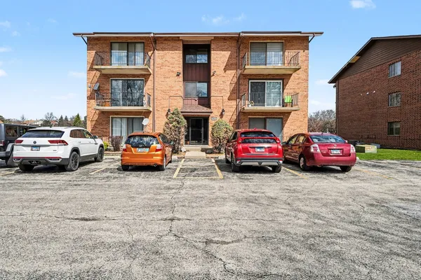a view of a cars parked in front of a building