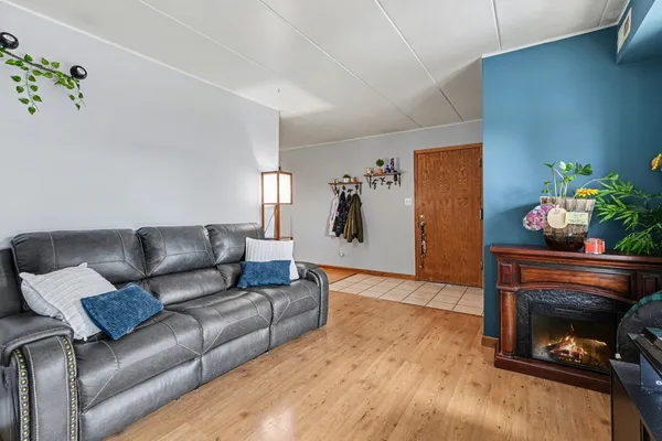 a living room with furniture and flowers