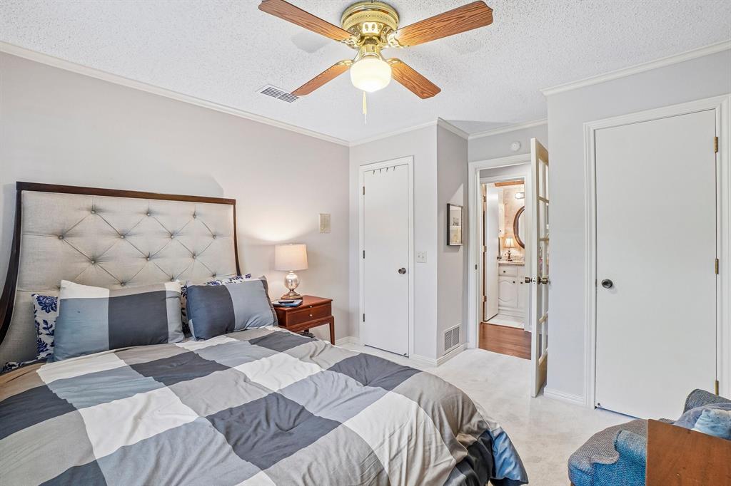 12929 Jasoncrest Trail Dallas, TX 75243 - Photo 30 of 38 Bedroom space featuring light-colored walls and soft carpeting
