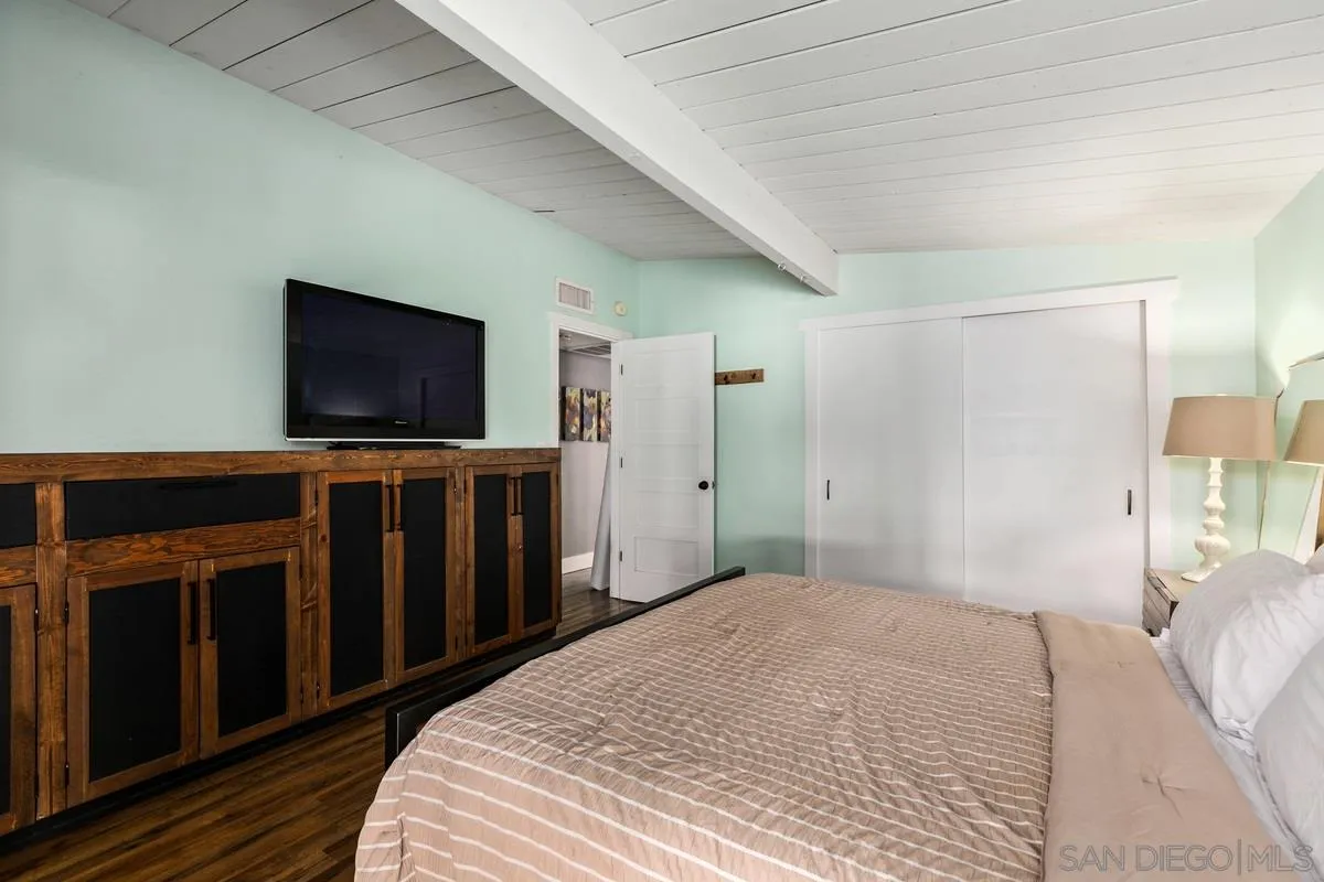 8605 Ellsworth Lane Santee, CA 92071 - Photo 13 of 26 a bedroom with a bed and a flat screen tv