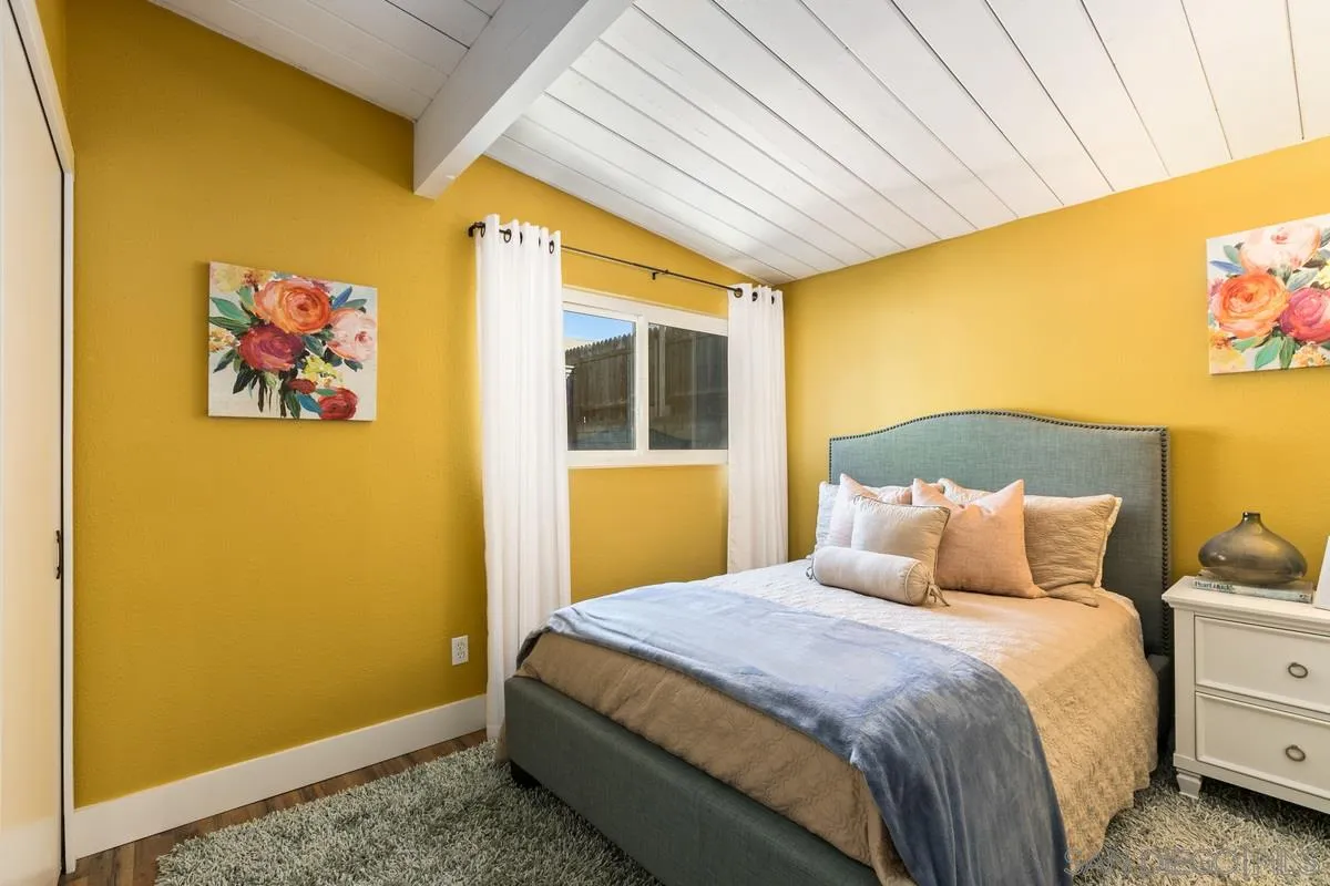 8605 Ellsworth Lane Santee, CA 92071 - Photo 17 of 26 a bedroom with a bed and a painting on the wall