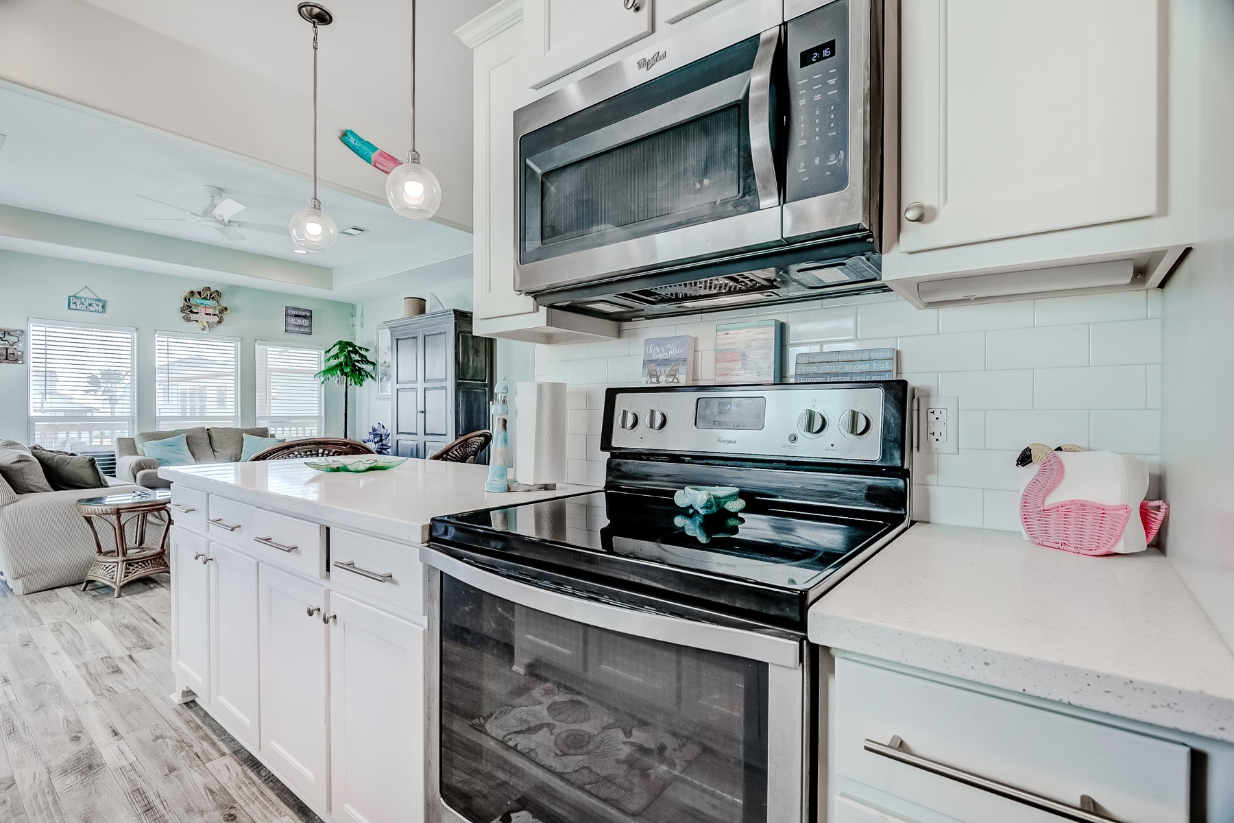 3292 Hidden Gold Crystal Beach Crystal Beach, TX 77650 - Photo 14 of 28 a kitchen with stainless steel appliances granite countertop a stove and a microwave