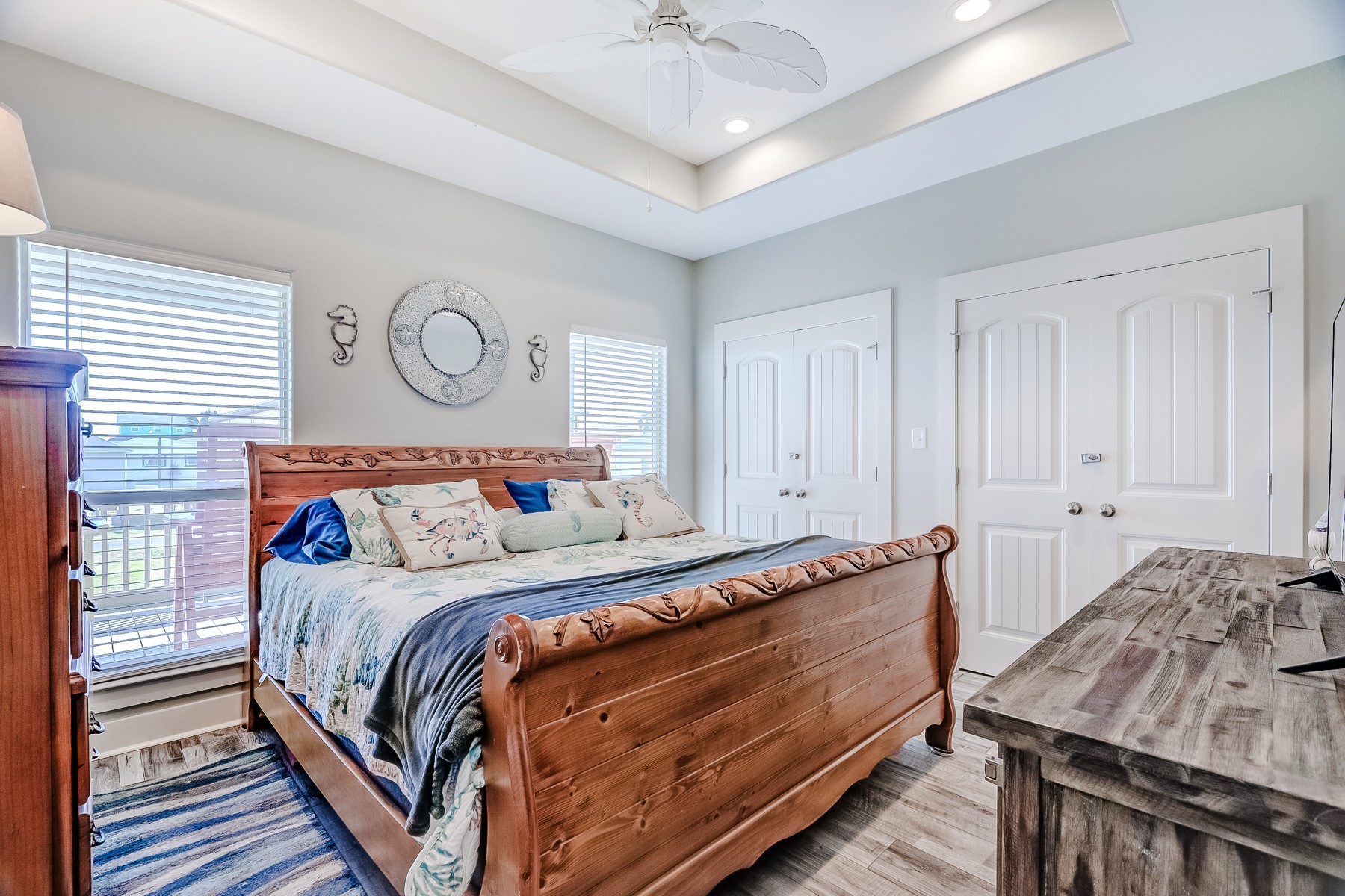 3292 Hidden Gold Crystal Beach Crystal Beach, TX 77650 - Photo 17 of 28 a bedroom with a bed and a chandelier