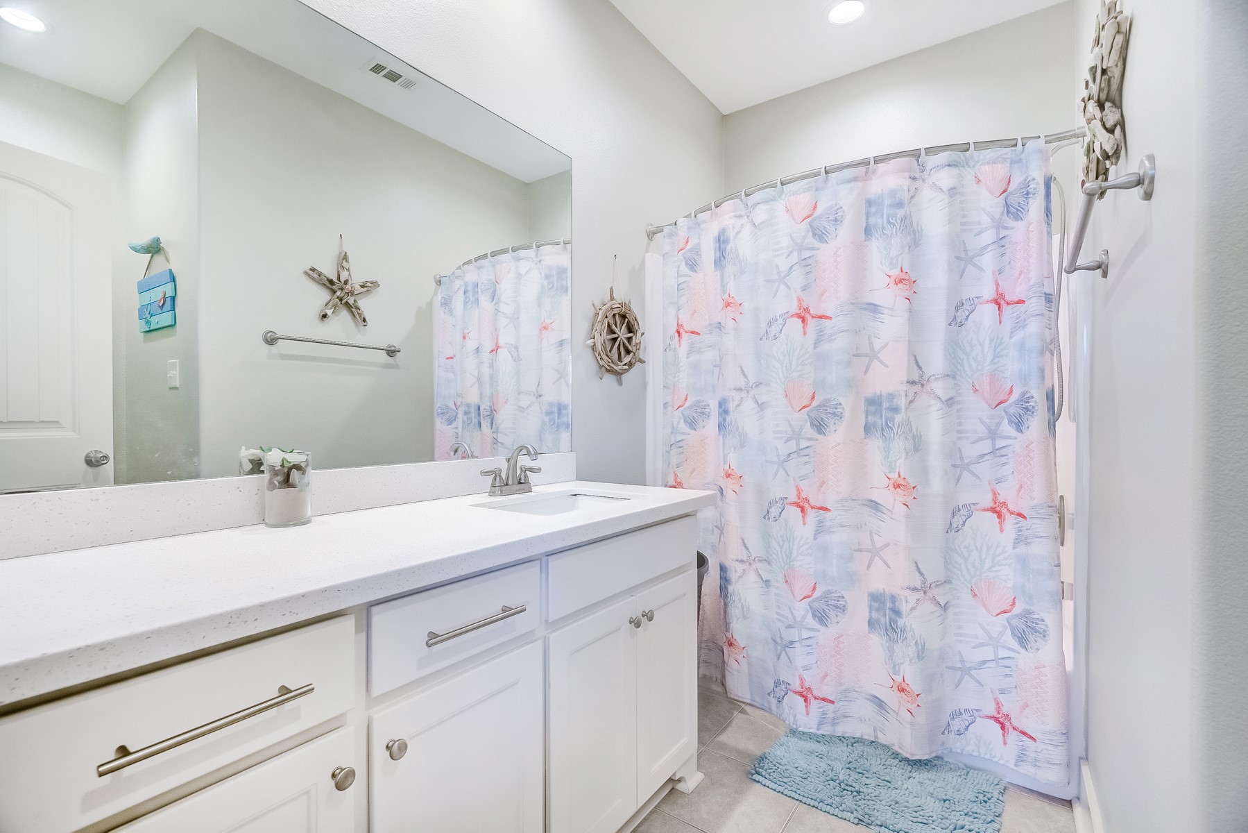 3292 Hidden Gold Crystal Beach Crystal Beach, TX 77650 - Photo 19 of 28 a bathroom with a sink and a mirror