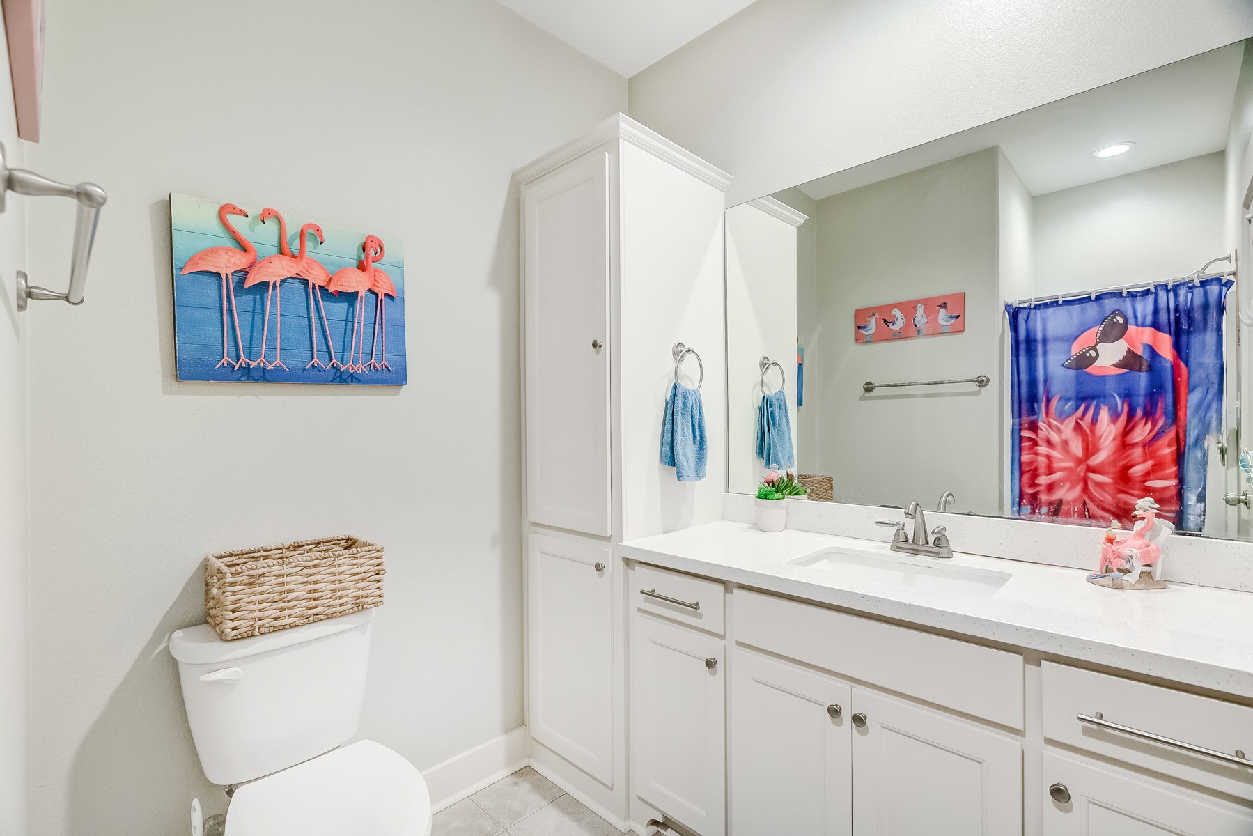 3292 Hidden Gold Crystal Beach Crystal Beach, TX 77650 - Photo 21 of 28 a bathroom with a toilet a sink and a mirror