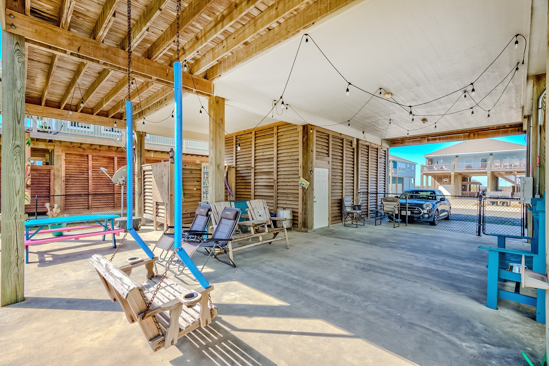 3292 Hidden Gold Crystal Beach Crystal Beach, TX 77650 - Photo 23 of 28 a living room filled with furniture gym equipment and a large window