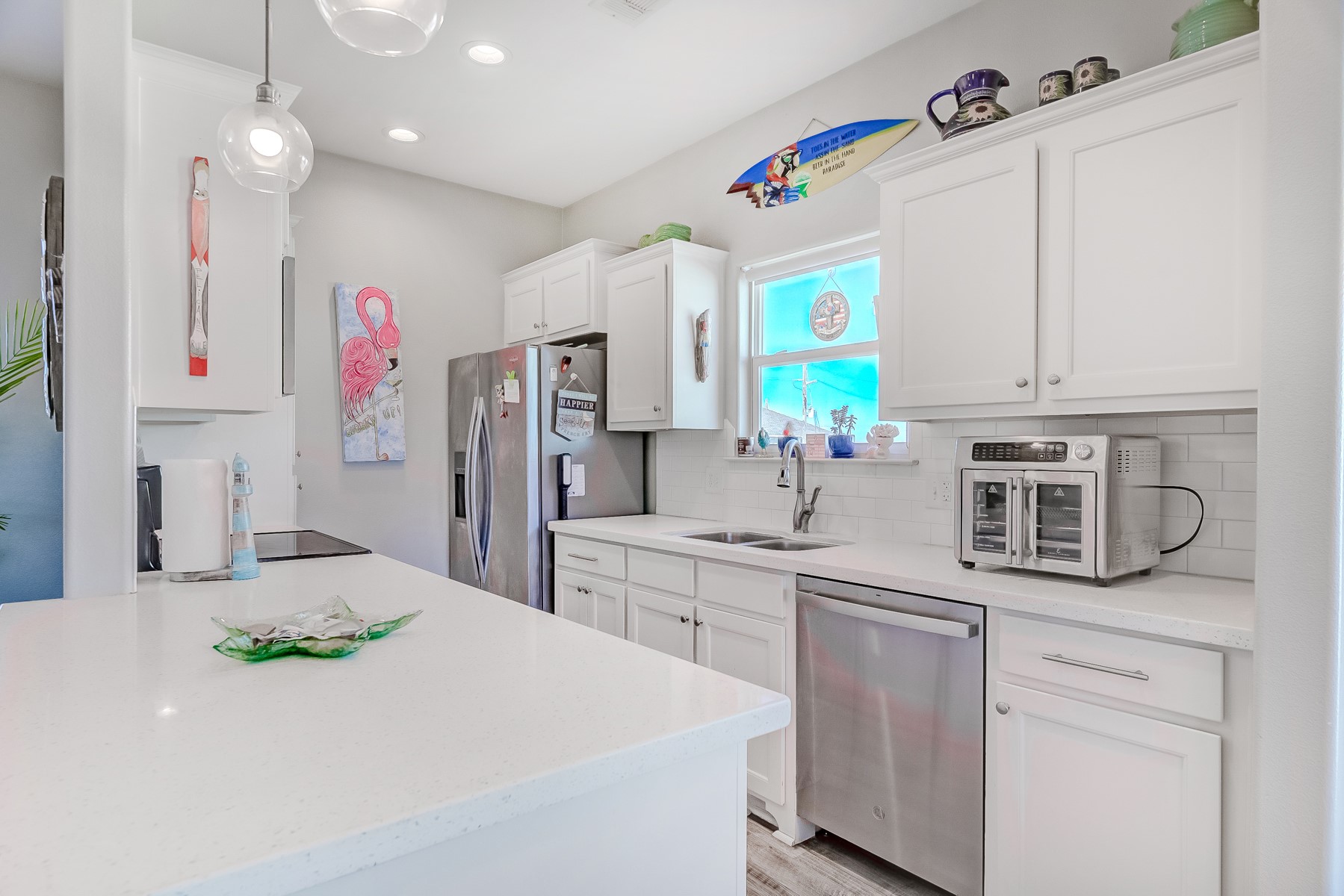 3292 Hidden Gold Crystal Beach Crystal Beach, TX 77650 - Photo 10 of 28 a kitchen with kitchen island granite countertop a sink stainless steel appliances and cabinets